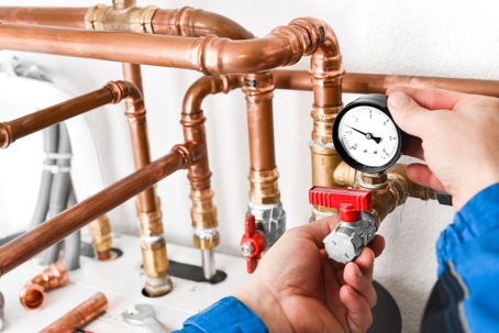 Technician checking the water pressure